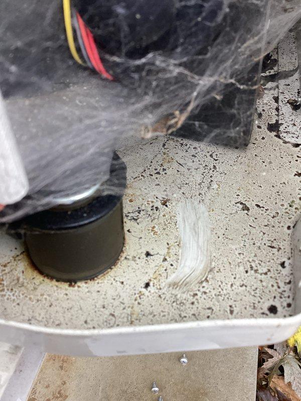 Responded to no heat/cooling complaint with refrigerant leak code PC03. Inspection revealed oil residue on bottom of unit, confirming active refrigerant leak. Visual inspection showed evidence of refrigerant loss, with cobwebs and dust accumulation in component housing area. Customer was notified of findings as requested.