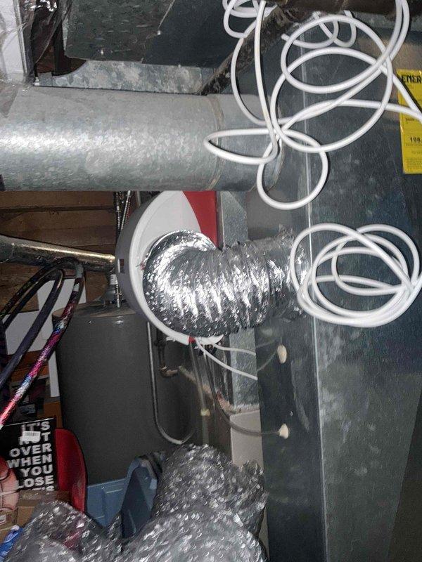 Performed comprehensive inspection of existing HVAC system in utility room. Evaluated current furnace unit showing signs of deterioration with exposed internal wiring and mechanical components. Assessed ductwork condition including galvanized main trunk lines and flexible duct connector to register. Provided estimate for complete system replacement including properly sized equipment and required modifications to existing ventilation pathways.