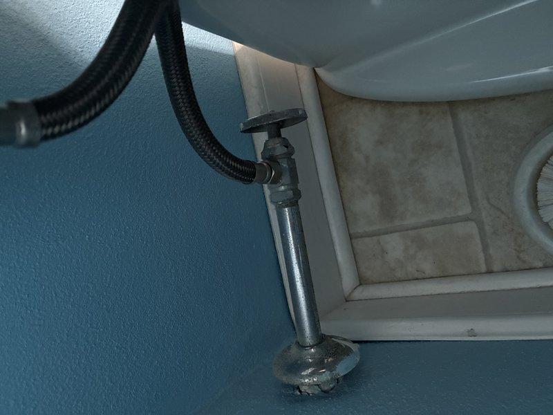 Performed comprehensive inspection of bathroom plumbing components including examination of metal water supply line with shutoff valve connected to porcelain fixture. Inspected under-sink drainage system consisting of PVC pipes, joints, and water flow control valves for proper function and potential leaks. All components appeared functional with no active leaks detected, though minor aging observed on metal surfaces.