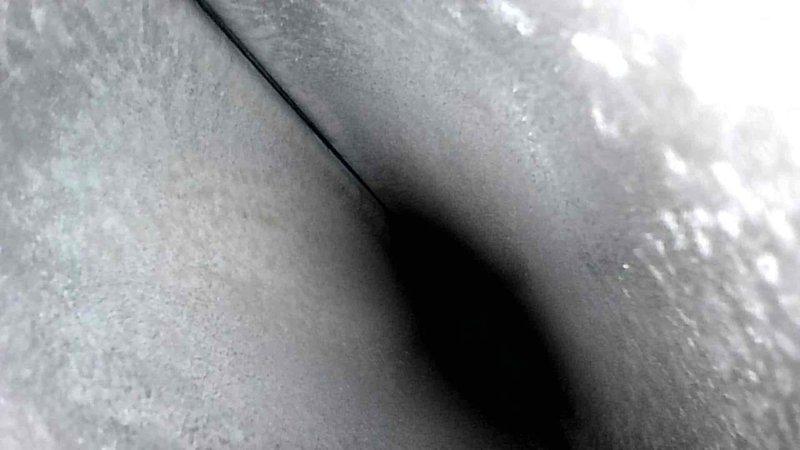 Conducted HVAC ductwork inspection, identifying and documenting internal conditions with photographic evidence. Visual assessment revealed potential areas of concern in ductwork junctions and surfaces requiring further evaluation.