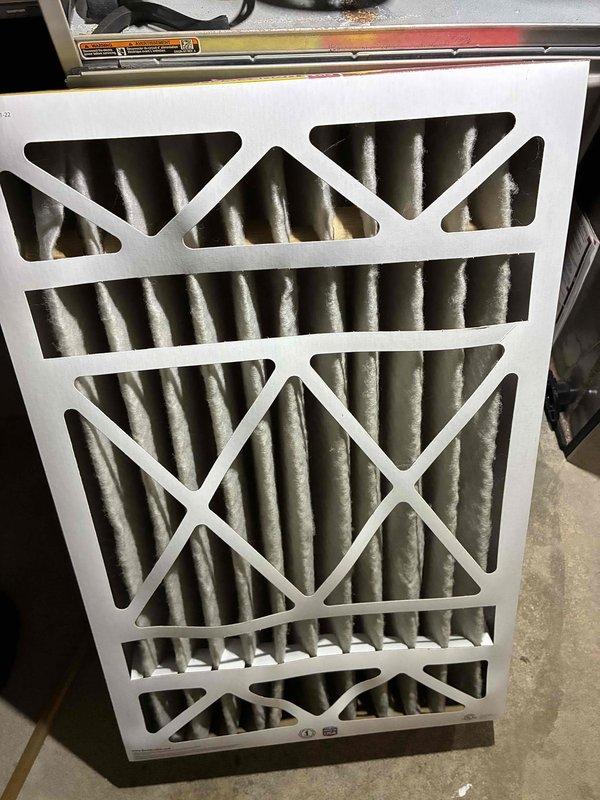 Performed routine HVAC tune-up service which included inspection and evaluation of the system. Replaced heavily soiled air filter that showed significant dust accumulation. Temperature readings with digital thermometer confirmed system is operating within normal temperature range at 102.9°F.