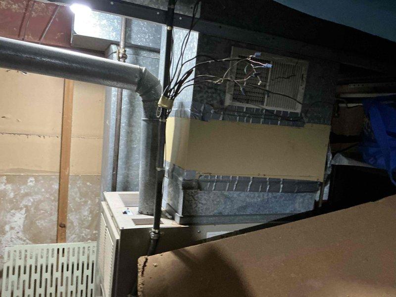 Completed comprehensive inspection of existing HVAC system including indoor air handler/furnace unit in mechanical room and outdoor heat pump/condenser units. Snow accumulation was observed on outdoor equipment, particularly heavy on one unit. Recommended full system replacement due to visible aging components, deteriorating ductwork connections, and equipment inefficiency evidenced by condition assessment.