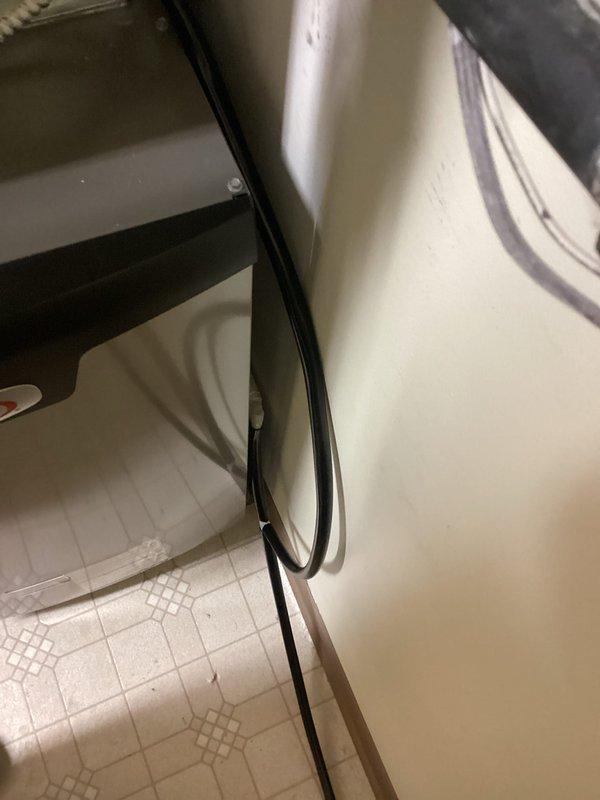 Completed installation of furnace with proper gas regulator setup and plumbing connections. Installed new pressure valve with associated black metal gas piping and PVC drainage system. Ensured proper cable routing along fixture edge with secure connections to electrical control unit.