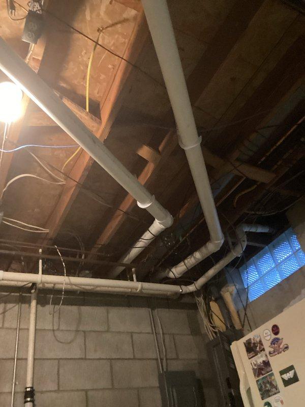 Performed standard HVAC tune-up service on the Goodman air handler unit located in basement utility area. Inspected PVC ductwork connections and verified proper system operation. All components functioning as intended with no issues detected.