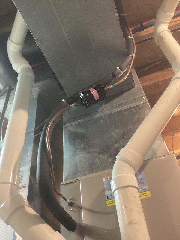Performed standard HVAC tune-up service on the Goodman air handler unit located in basement utility area. Inspected PVC ductwork connections and verified proper system operation. All components functioning as intended with no issues detected.