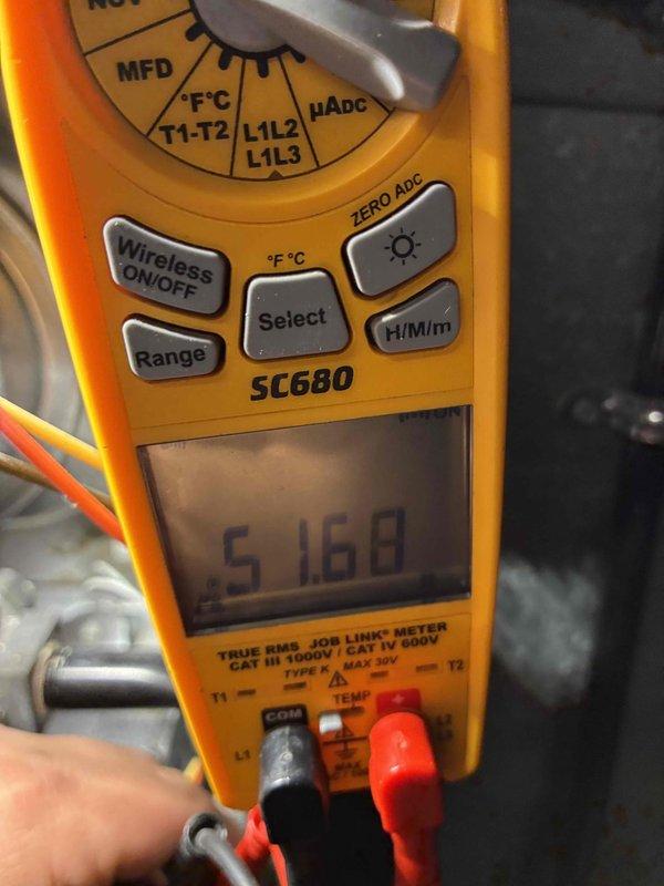 Performed standard maintenance tune-up on HVAC system. Measured supply air temperature at 110.8°F and verified electrical parameters with SC680 multimeter, confirming 51.68 μF capacitor reading. System functioning within normal parameters after service.