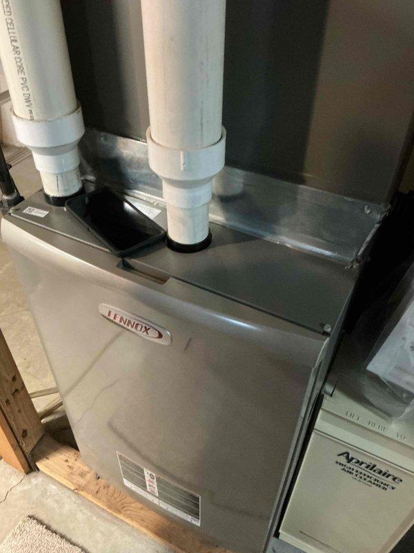 Performed routine maintenance on Lennox furnace system. Inspected interior ductwork, verified proper installation of PVC exhaust and intake venting, and confirmed Aprilaire equipment integration. All components found to be in normal operating condition.