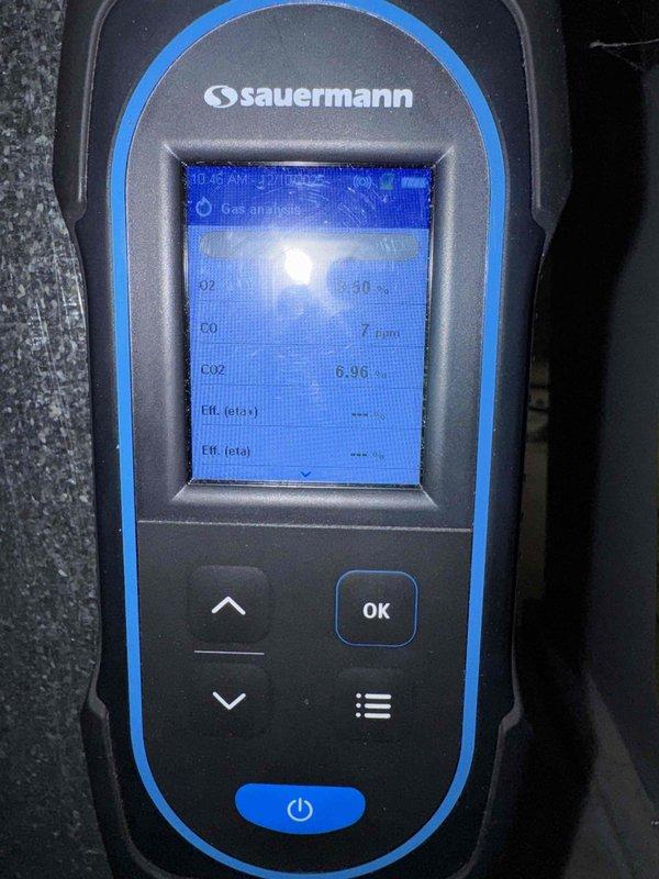 Performed annual maintenance service on Carrier furnace in mechanical room. Conducted combustion analysis with Sauermann gas analyzer, measuring O2 and CO2 levels (CO2 at 0.96%) to verify proper combustion efficiency. System is operating correctly with no issues detected.