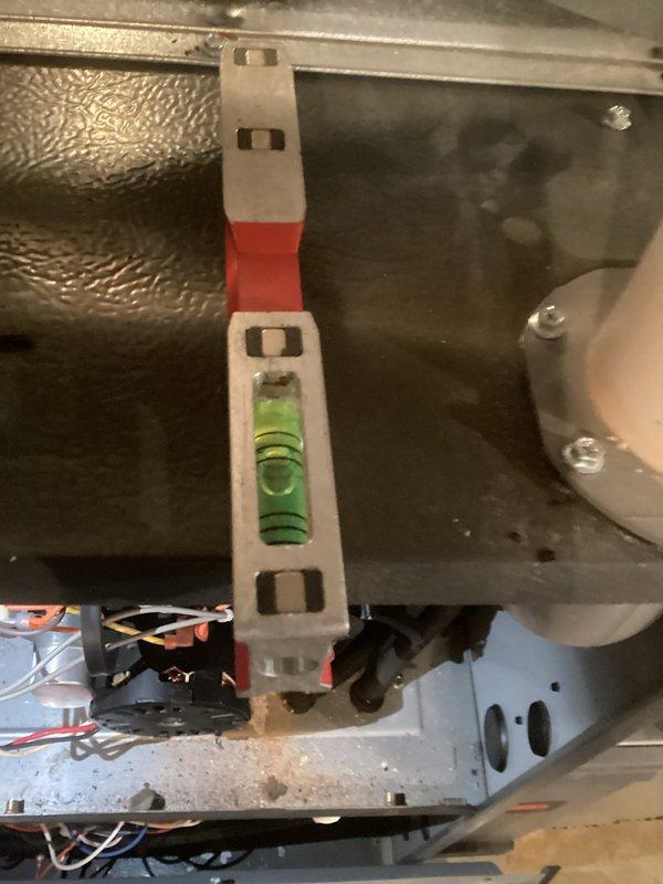 Performed comprehensive system tune-up on HVAC unit. Verified proper level installation of equipment using calibration tool and inspected internal electrical components including motor wiring and circuit board connections. All systems functioning within normal parameters after service.