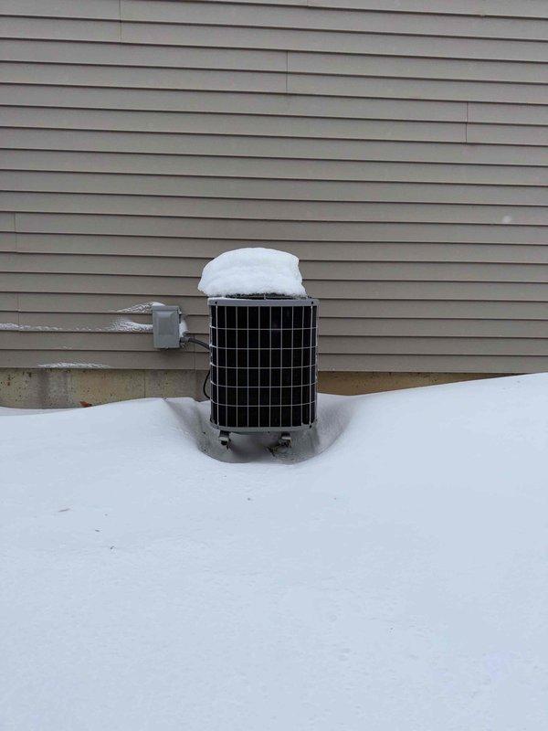 Performed assessment for replacement of existing outdoor condenser unit showing significant snow accumulation and potential winter weather damage. Evaluated current system which includes 2" Cresline CPVC DWV Schedule 40 plumbing in basement utility area. Recommended replacement with appropriately sized unit to be installed on existing concrete pad with proper electrical connections to junction box.