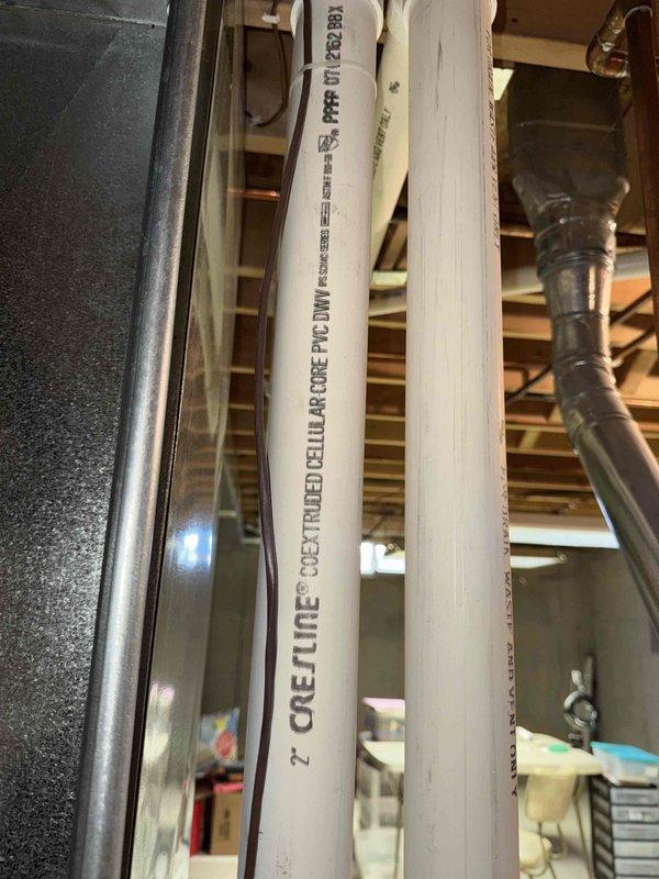 Performed assessment for replacement of existing outdoor condenser unit showing significant snow accumulation and potential winter weather damage. Evaluated current system which includes 2" Cresline CPVC DWV Schedule 40 plumbing in basement utility area. Recommended replacement with appropriately sized unit to be installed on existing concrete pad with proper electrical connections to junction box.