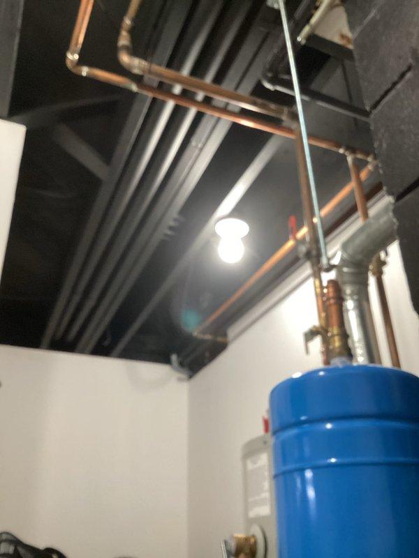 Performed routine preventative maintenance on HVAC system. Inspected mechanical room equipment including copper supply/return lines, expansion tank, and associated valving. Examined insulated distribution piping and control mechanisms, noting proper installation and function. All components operating within normal parameters.