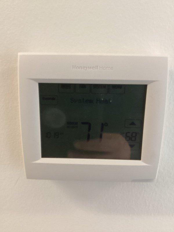 Completed installation of a new Honeywell Home digital thermostat. Mounted unit securely on wall, configured system settings for heating functionality, and verified proper operation with successful temperature display and control functions. System is now operating correctly in heat mode with appropriate temperature regulation.
