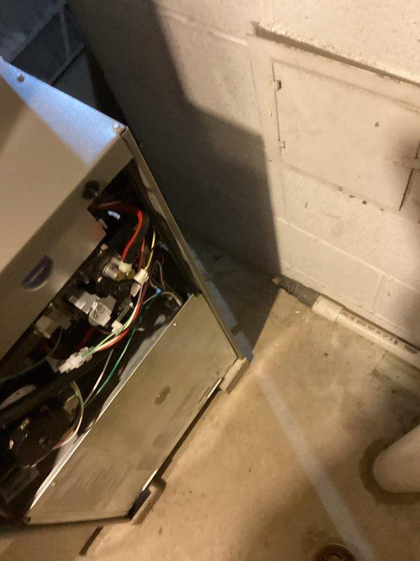 Successfully completed installation of a new Lennox furnace with dual PVC exhaust/intake ventilation system in utility area. Installed unit with proper electrical connections including color-coded wiring for safe operation. All ductwork and refrigerant lines were properly connected and tested to ensure optimal system performance.