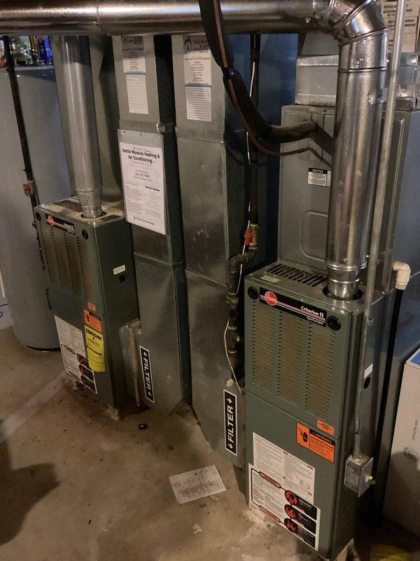 Completed dual-system furnace inspection in mechanical room. Visually inspected Ruud furnace units, associated ductwork, and connections. Both systems appeared to be in normal working condition with no visible damage or abnormalities noted. Confirmed proper installation of ventilation system and verified safety warning labels were intact and visible.