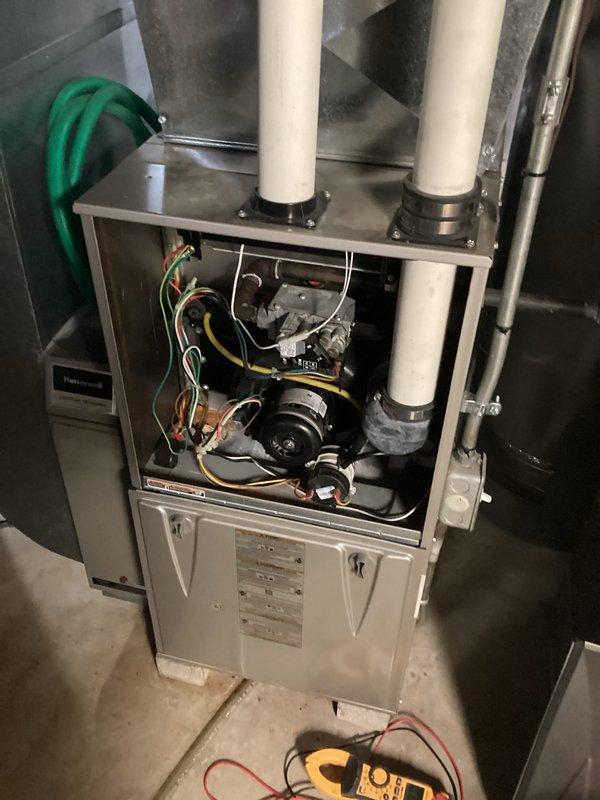 Responded to no-heat call for residential furnace under 10 years old. Diagnostic testing revealed a faulty pressure switch preventing system operation. Replaced Honeywell pressure switch, verified proper connections of all electrical components including circuit board wiring, and conducted complete system test. Unit now functioning correctly with normal heat output and proper cycling.