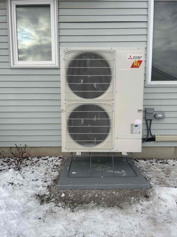 Successfully installed a Mitsubishi H2i heat pump system with the outdoor unit properly mounted on a concrete pad and secured to the residence. System was evacuated to 108 microns as verified with Yellow Jacket digital vacuum gauge, ensuring proper dehydration of the refrigerant circuit before commissioning. All electrical connections were completed according to manufacturer specifications with required safety measures implemented.