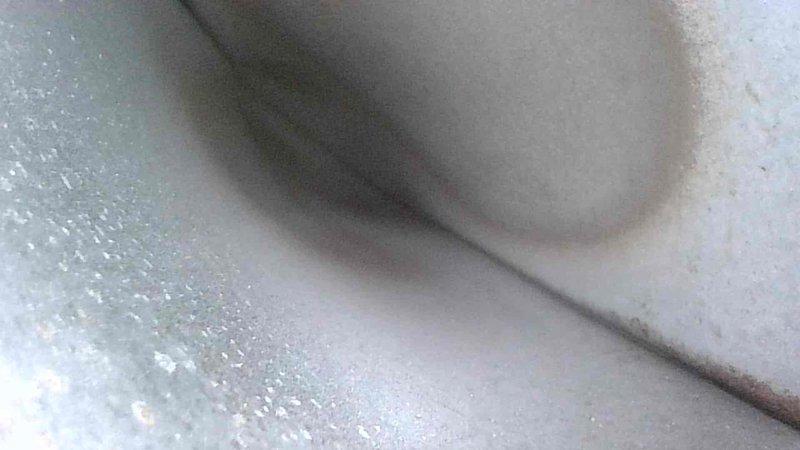 Conducted routine HVAC tune-up service with thermal inspection of ductwork system. Temperature readings showed 181°F at measured point on supply duct, indicating proper operation within normal parameters. Inspected and verified integrity of ductwork connections and adjacent PVC plumbing infrastructure.