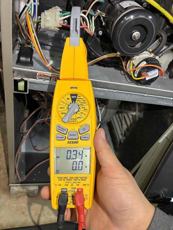 Performed comprehensive electrical diagnostic testing on HVAC system using Fieldpiece SC680 multimeter. Measured amperage draw (34 amps) and voltage parameters (5669 ohms), verifying proper electrical operation of motor/fan assembly. All connections and wiring integrity confirmed within manufacturer specifications.