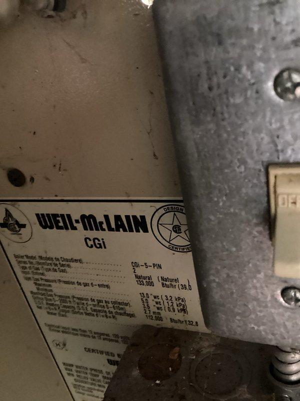 Performed routine maintenance tune-up on Weil-McLain CGi boiler system. Inspected heat exchanger tubes for proper condition and function, noting slight oxidation but no significant deterioration. Verified proper connection of control wiring at heat exchanger assembly. System operating within manufacturer specifications with gas pressure confirmed at 12.5" WC.