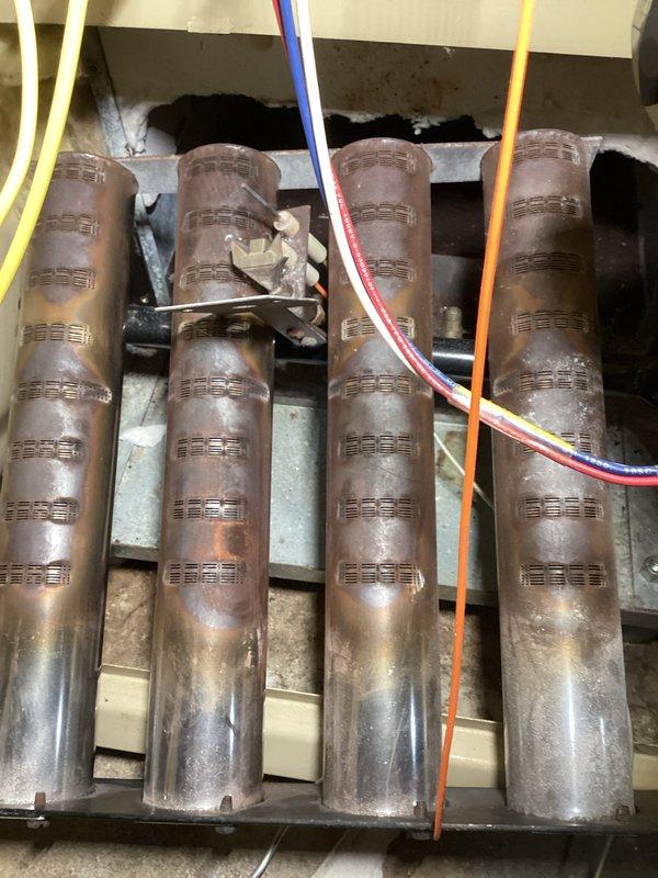 Performed routine maintenance tune-up on Weil-McLain CGi boiler system. Inspected heat exchanger tubes for proper condition and function, noting slight oxidation but no significant deterioration. Verified proper connection of control wiring at heat exchanger assembly. System operating within manufacturer specifications with gas pressure confirmed at 12.5" WC.