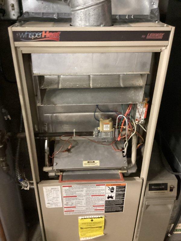 Performed comprehensive tune-up on Lennox "Whisper Heat" furnace. Inspected heat exchanger assembly, burner assembly, and control board for proper operation. Cleaned dust accumulation from internal components and verified integrity of electrical connections, including wiring to Honeywell control module. All systems tested and confirmed to be functioning within manufacturer specifications.