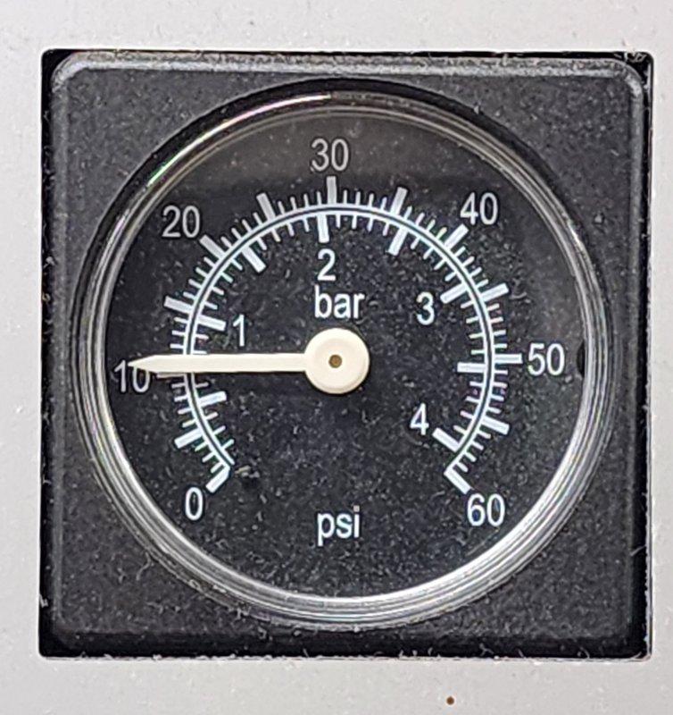Conducted inspection of Triangle Tube Prestige boiler system. Pressure gauge reading was verified at approximately 1.1 bar (15 psi), confirming proper system pressure within normal operating range. Visual inspection of all connected PVC venting and copper supply lines revealed no leaks or irregularities.