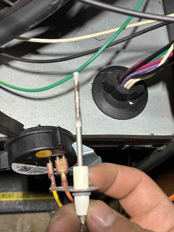 Performed comprehensive HVAC tune-up including inspection of electrical components and ignition system. Removed and checked igniter assembly, noting normal wear. Inspected wiring connections at control board and pressure switch, ensuring proper electrical continuity throughout system. All components tested and verified operational.