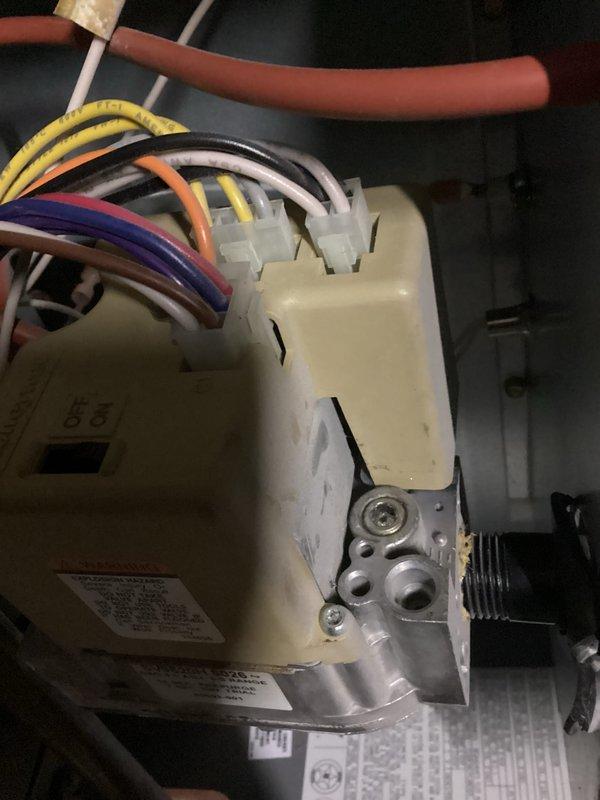 Performed scheduled tune-up service on customer's HVAC system, which included carbon monoxide testing showing readings of 25 PPM. Inspected the control board and wiring connections, noting normal wear on the plastic housing but confirming all wires (yellow, purple, white, orange, and black) were properly secured to terminals. Verified system operation meets manufacturer specifications.