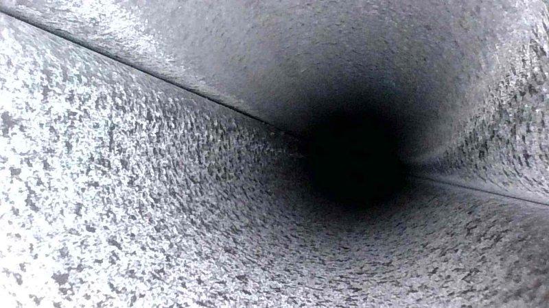 Conducted routine HVAC tune-up service, with detailed inspection of the ductwork system. Examined internal duct surfaces, noting normal accumulation of dust on concrete surfaces with intact seams and joints. System appears to be functioning properly with no structural issues observed in ventilation passages.