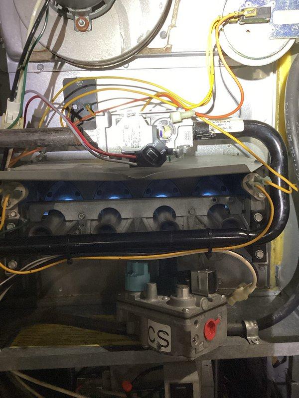 Diagnosed and serviced 10+ year old Honeywell furnace that was not producing heat. Upon inspection, identified issues with the gas valve assembly and ignition sequence. Cleaned flame sensor, reset control board, and verified proper gas flow through manifold. After repairs, tested system operation with all burners showing proper blue flame pattern and confirmed normal heat cycle completion. Unit now operating at expected efficiency.