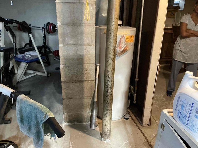 Conducted onsite inspection of existing water heater system in basement utility area. Unit shows visible corrosion and mineral buildup on connecting pipes. Recommended full replacement of aging water heater with appropriate capacity unit to ensure reliable hot water supply and improved energy efficiency.