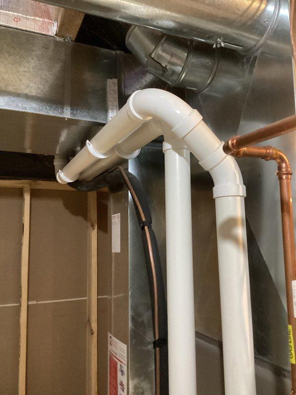 Performed comprehensive HVAC tune-up service including combustion analysis with Bacharach analyzer, which confirmed optimal system efficiency at 96.7% with CO levels at 31 ppm and CO2 at 7.6%. Inspected ventilation components and PVC exhaust piping system, verifying proper installation and confirming no signs of deterioration or compromise to the vent assembly.