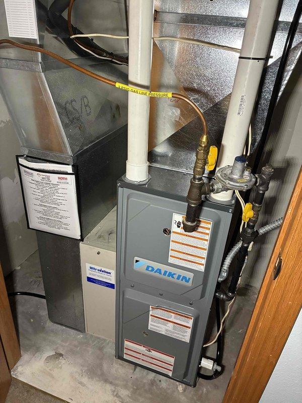 Performed warranty service on Daikin HVAC system. Inspected interior components including blower assembly, control panel, and electrical wiring connections. Documented proper installation of gas lines, PVC venting, and ductwork. System is functioning within manufacturer specifications.