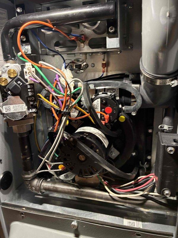 Performed warranty service on Daikin HVAC system. Inspected interior components including blower assembly, control panel, and electrical wiring connections. Documented proper installation of gas lines, PVC venting, and ductwork. System is functioning within manufacturer specifications.