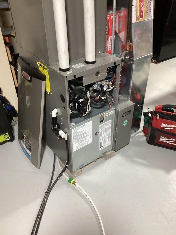 Conducted routine prepaid HVAC maintenance service on customer's furnace system, performing comprehensive inspection of internal components including control board, wiring, and ventilation pipes. Checked all connections and verified proper operation of the unit while examining the ductwork in the unfinished basement for proper installation and airflow.