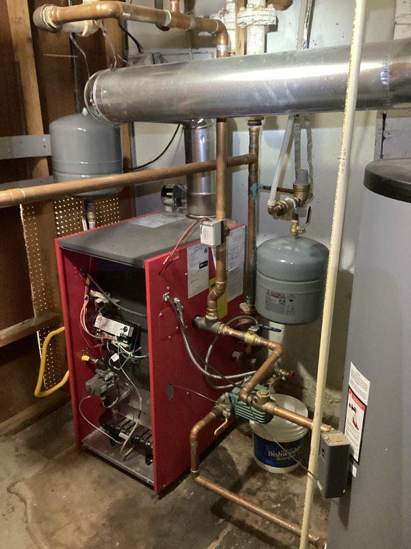 Completed boiler system inspection and maintenance. Identified and resolved copper pipe corrosion at expansion tank connection. Checked proper operation of circulator pump, ensuring system maintains appropriate pressure and expansion capacity.