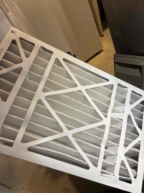 Completed tune-up service on HVAC system including replacement of air filter with new pleated filter. Performed electrical diagnostics using SC680 clamp meter, confirming proper voltage readings of 0.46V, which indicates normal operational parameters within manufacturer specifications.