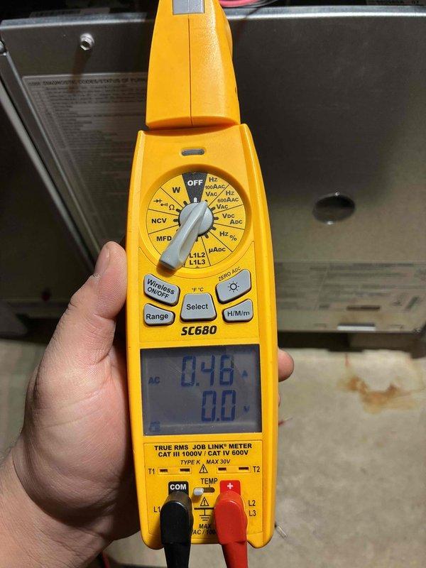 Completed tune-up service on HVAC system including replacement of air filter with new pleated filter. Performed electrical diagnostics using SC680 clamp meter, confirming proper voltage readings of 0.46V, which indicates normal operational parameters within manufacturer specifications.