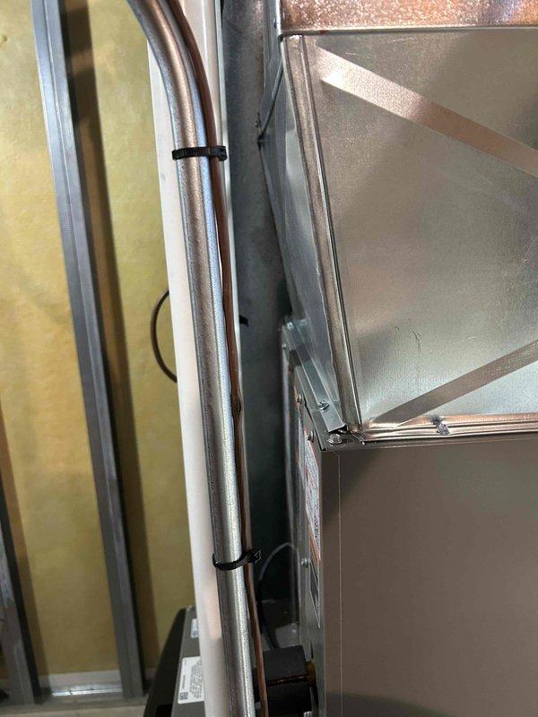 Successfully installed a complete HVAC system featuring a Honeywell Home digital thermostat with temperature control functionality. System installation included proper mounting of equipment cabinet with secure copper line connections and appropriate fastening to ensure optimal system performance.