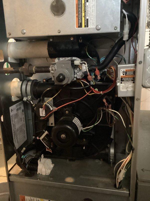 Performed comprehensive maintenance tune-up on residential HVAC system. Inspected interior furnace components including motor assembly, electrical connections, and valve functionality. Examined ceiling/basement ventilation systems, PVC piping infrastructure, and verified proper ductwork installation with attention to electrical connections and system safety parameters.