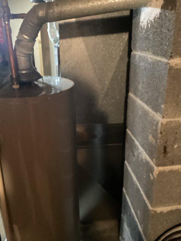 Completed installation of new furnace in basement utility area, including proper connection to existing water heater system. Installed new ductwork along foundation wall with appropriate clearance and secure mounting to ensure optimal airflow and system performance.