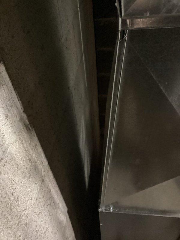 Completed installation of new furnace in basement utility area, including proper connection to existing water heater system. Installed new ductwork along foundation wall with appropriate clearance and secure mounting to ensure optimal airflow and system performance.