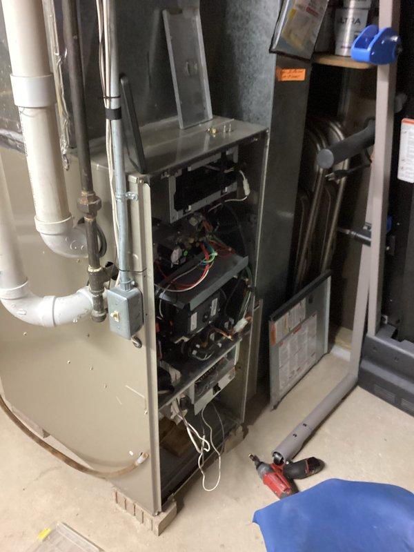 Performed comprehensive gas furnace tune-up including combustion analysis using Testo 310 II analyzer. Readings confirmed proper flue gas parameters with CO at 9ppm, efficiency at 90.7%, and CO₂ at 4.14%. Inspected internal components after removing access panel, checked electrical connections and wiring integrity. All system parameters operating within manufacturer specifications.