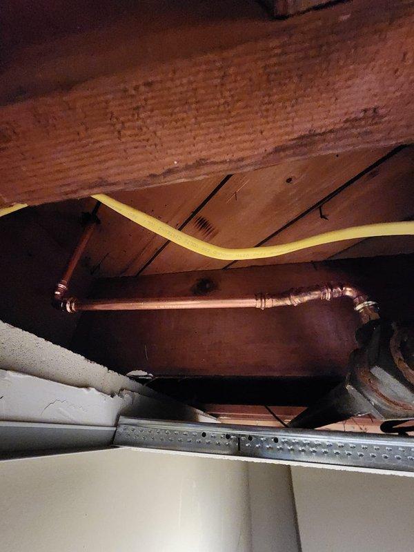 Successfully installed a new boiler system with copper supply lines running through floor joists. Installed brass air vent/pressure relief valve assembly against concrete block wall and connected PVC exhaust components according to manufacturer specifications.
