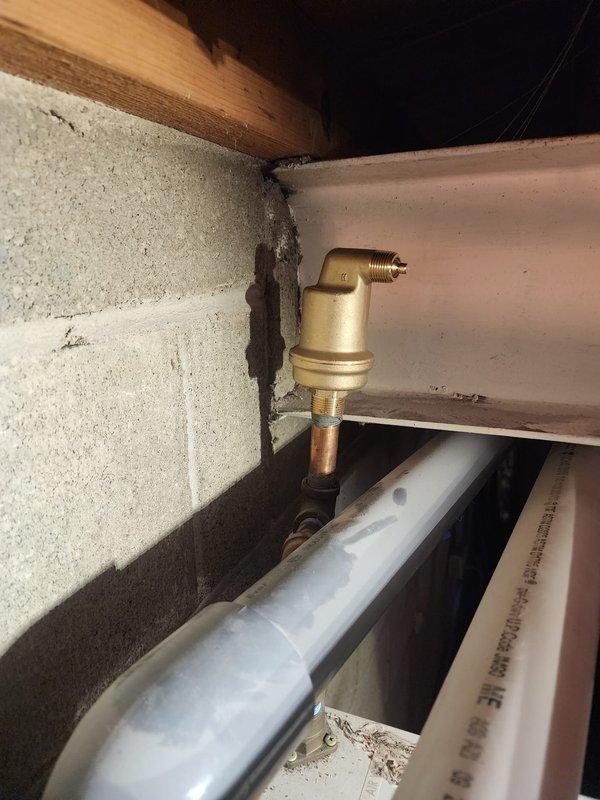 Successfully installed a new boiler system with copper supply lines running through floor joists. Installed brass air vent/pressure relief valve assembly against concrete block wall and connected PVC exhaust components according to manufacturer specifications.