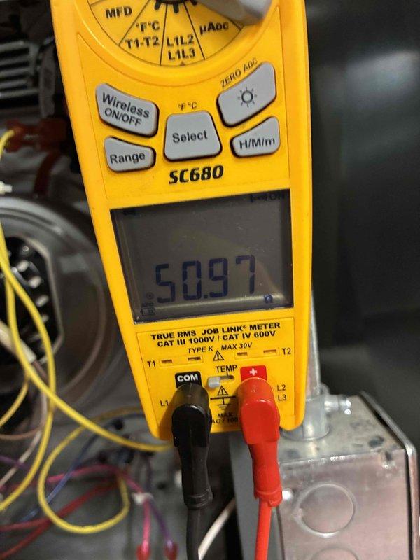 Performed routine diagnostic testing on HVAC system using Fieldpiece SC680 multimeter. Conducted DC electrical measurement (reading 2.0) and verified system capacitance (509.7 MFD). All electrical components functioning within acceptable parameters.