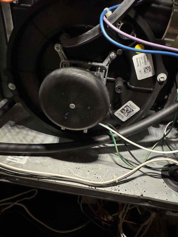 Inspected 10+ year old heating system that was non-operational. Discovered faulty blower motor with visible wire connection issues and deteriorated door gasket. Replaced blower motor assembly and installed new door seal to restore proper system operation and prevent air leakage. System now functioning normally with proper airflow.