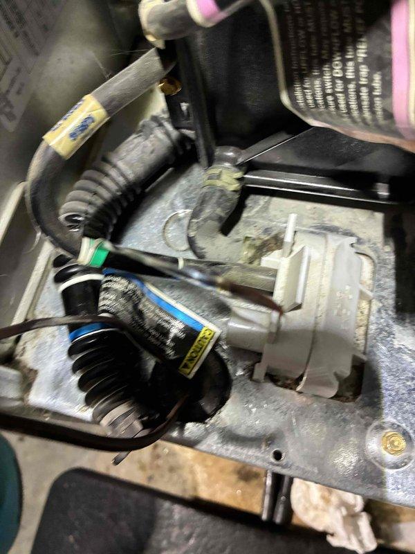 Responded to no heat complaint on unit less than 10 years old. Inspected system and found condensate drain basin significantly clogged with debris, causing water backup. Cleaned drain and confirmed proper operation of condensate removal system. Unit returned to normal functioning after service.