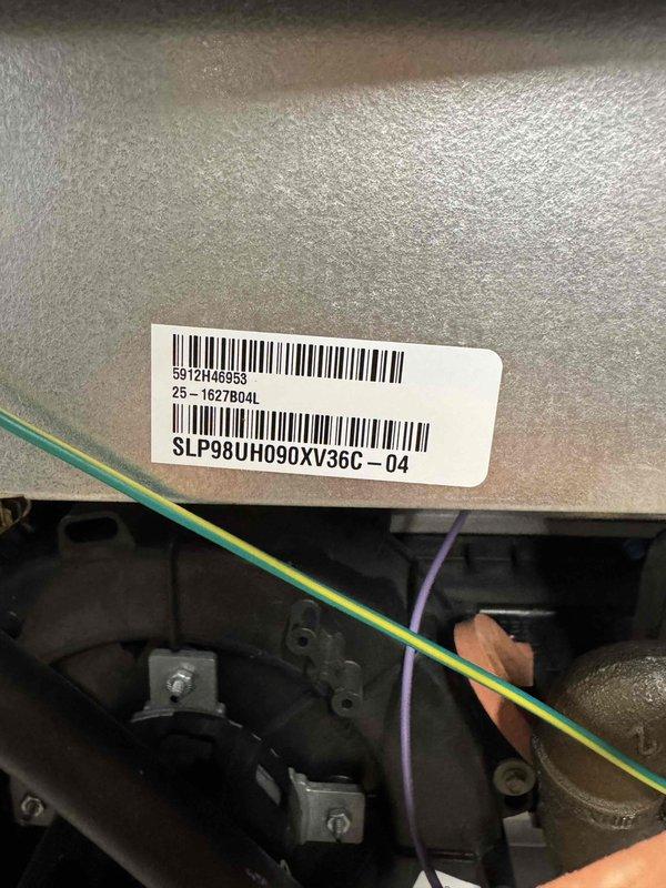 Performed inspection and evaluation of existing furnace (model SLP98UH090XV36C-04) in basement utility area. Documented infrastructure including water heater ventilation and ceiling-mounted PVC exhaust/intake piping system with multiple 90-degree joints. Noted proper installation of electrical connections including ground wire placement. Prepared comprehensive replacement estimate for customer review.